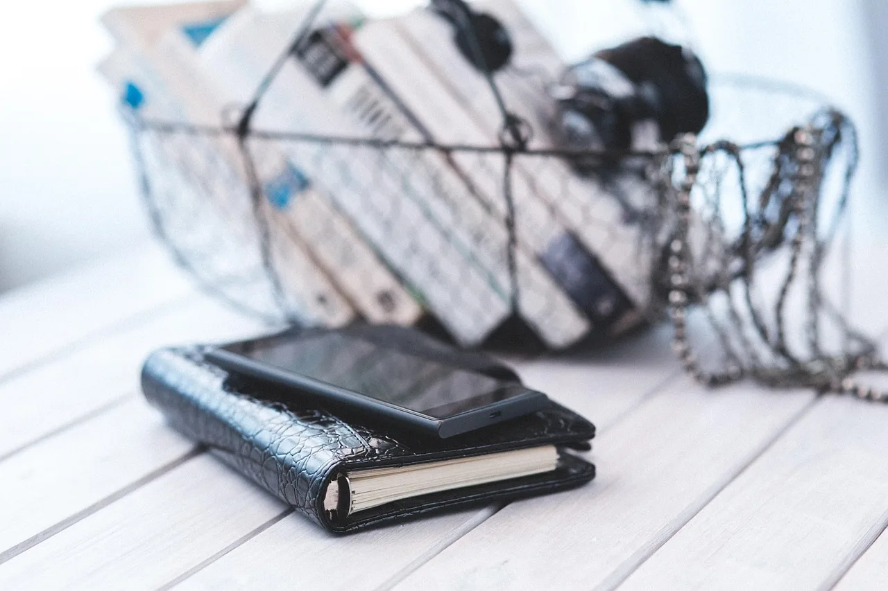 notebook, organizer, calendar, black, elegance, elegant, business, mobile, phone, cell, smartphone, technology, close up, closeup, close-up, detail. The money-making services in a virtual assistant agency