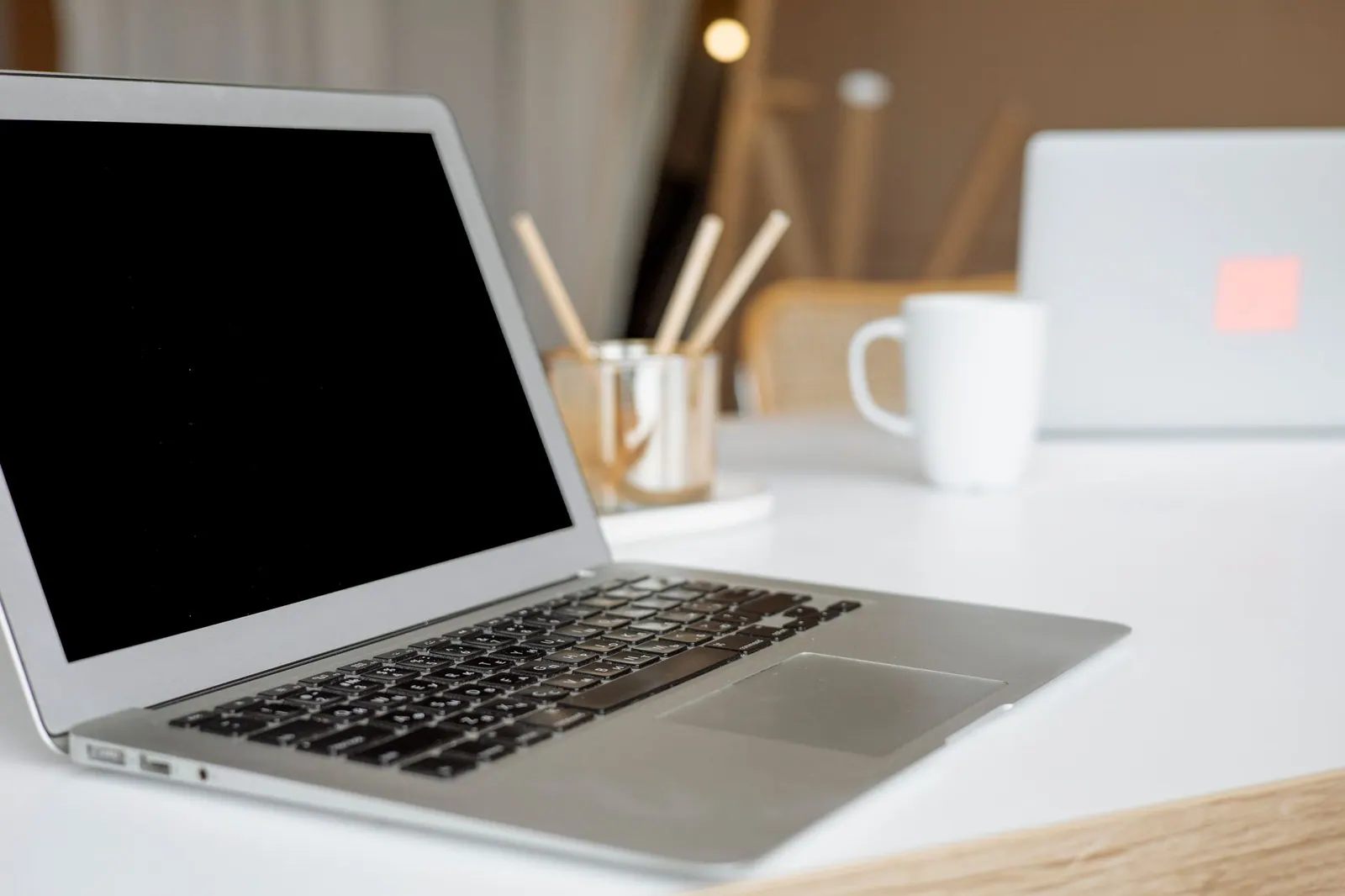 A sleek laptop on a modern office desk, ideal for remote work or business environments.