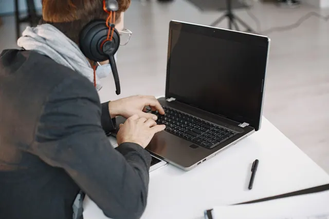 online, meeting, virtual, skype, zoom, video, conference, videoconference, webinar, remote, working, work, from, home, computer, businesswoman, pointing, couch, laptop, blue comput